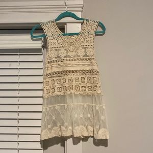 Lace top, goes well with tank top underneath.